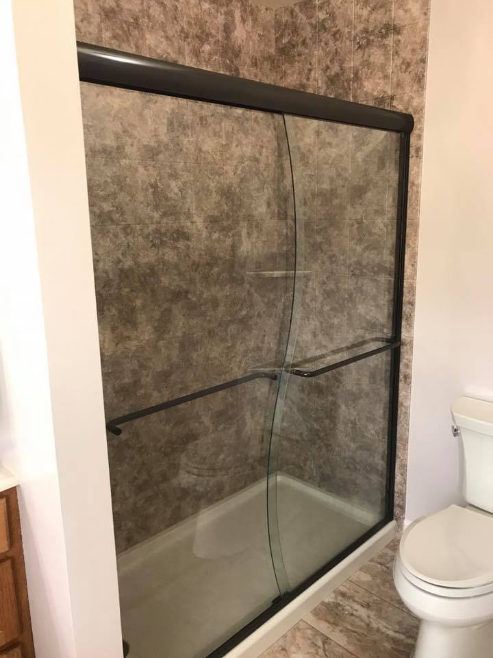 newly remodeled bathroom with shower doors