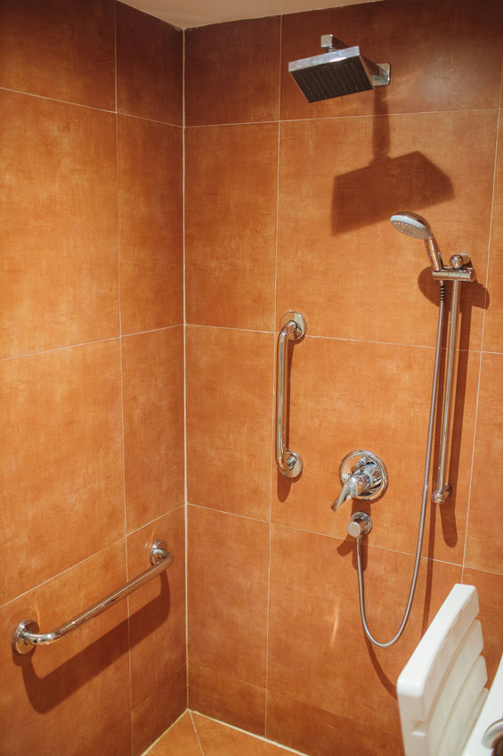 shower with seat and grab bars for disabled and elderly people in the bathroom.
