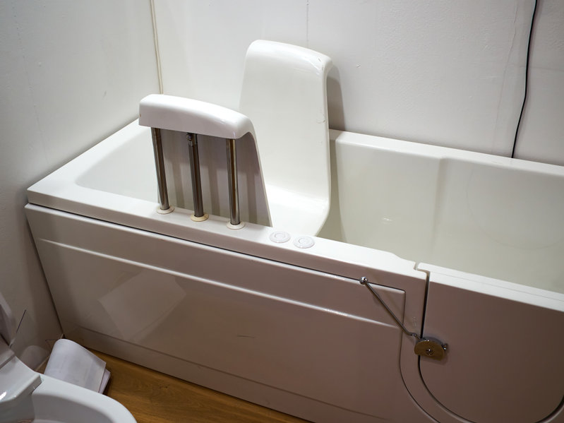 Handicapped disabled access bathroom bathtub with electric handles for people with disabilities
