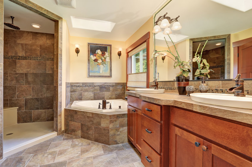 Lovely master bathroom with stone floor and large shower.